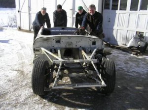 Pushing the stripped E-type back into storage