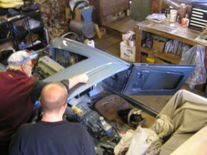 Butch & Gus mark out a Healey for windshield installation