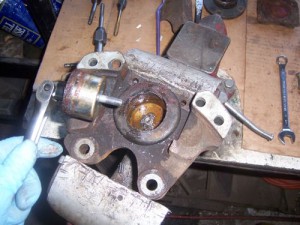 Caliper piston removed by drill & tap method
