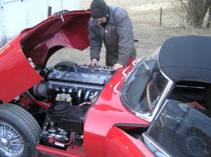Patrick makes a carb adjustment on the series 2 E-type