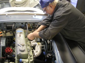 Butch bolts up a DMD intake manifold to a Healey 3000