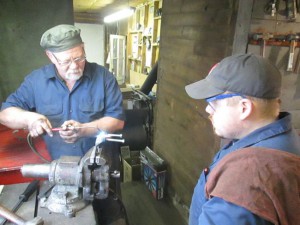 Straightening a brake caliper bracket by heating