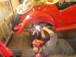 Butch welds up a broken brake hold down bracket