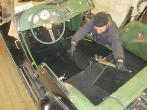 Steve lays out carpet in an MG TD