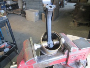MGB piston clamped in vice