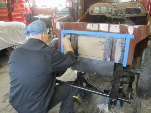 Butch paints the tank board on an MG TD