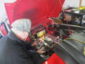 Butch fettles a TR3 carburetor